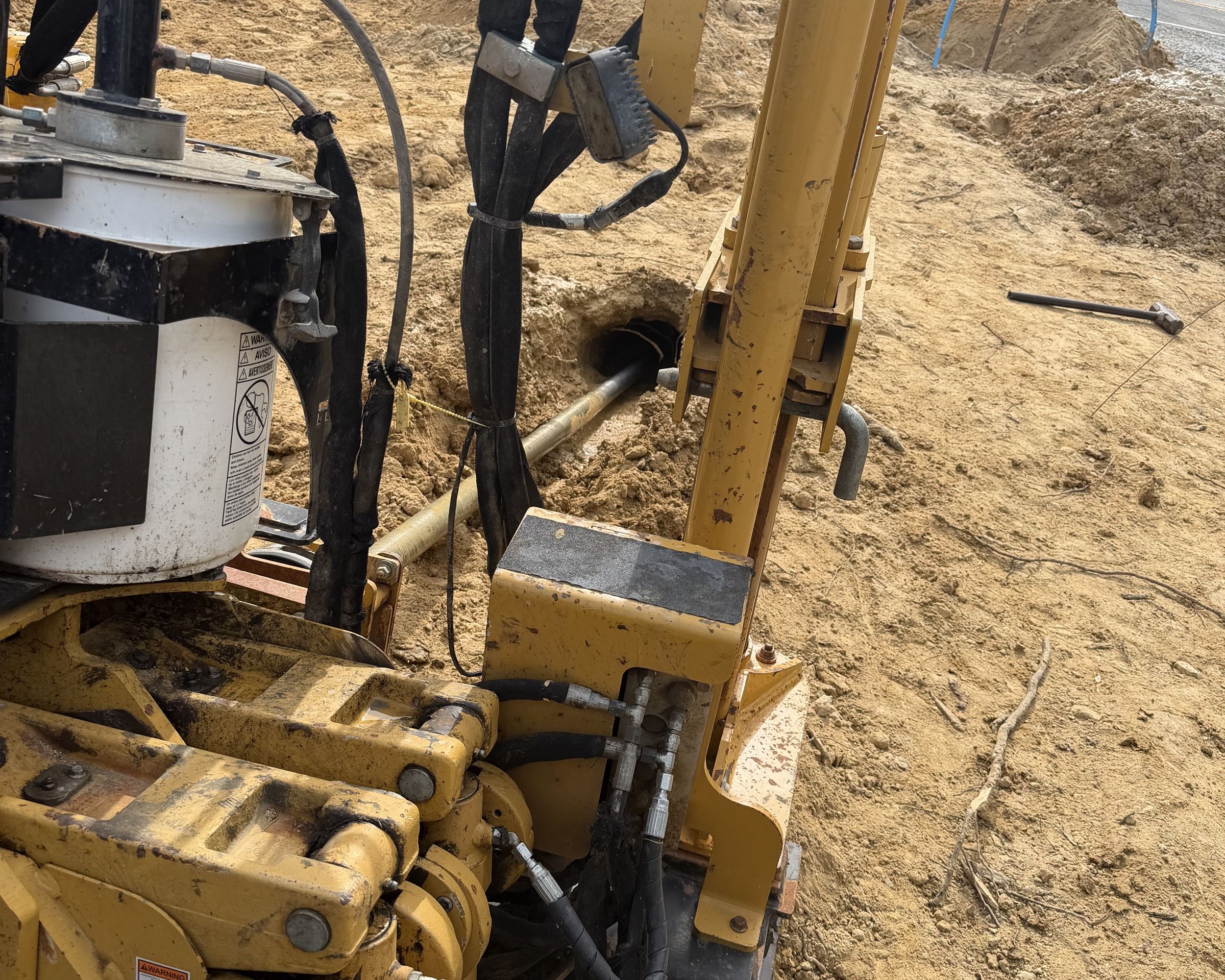 A drilling crew and rig on a South Carolina crossing.